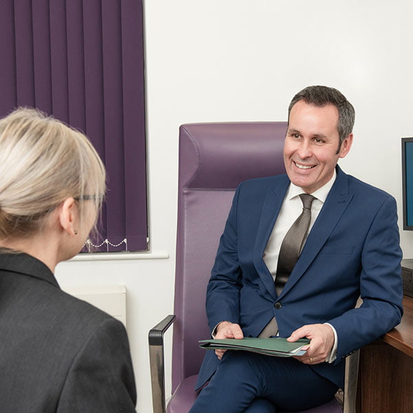 Vascular surgeon with a patient